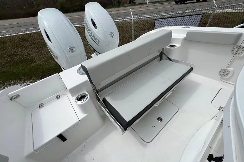 Slide: The Image of 2026 Sea Pro 262 Offshore boat with dual Suzuki engines and foldable seating. - 31