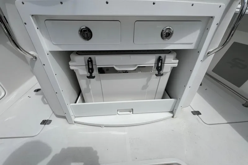 Slide: The Image of Storage compartment on 2026 Sea Pro 262 Offshore boat with cooler and drawers. - 33
