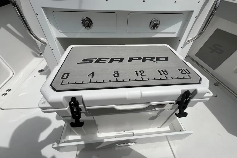 Slide: The Image of 2026 Sea Pro 262 Offshore boat cooler with measuring scale on deck. - 35
