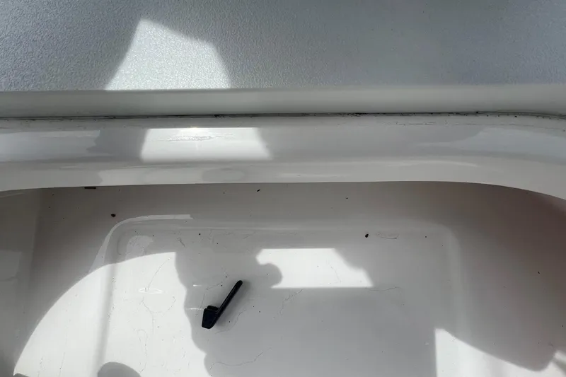 Slide: The Image of Storage compartment of 2026 Sea Pro 262 Offshore boat, featuring a clean white interior. - 36