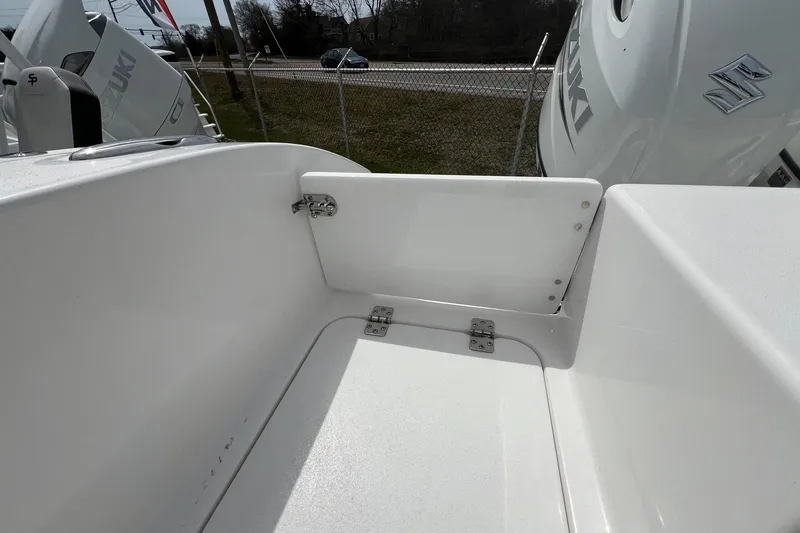 Slide: The Image of 2026 Sea Pro 262 Offshore boat interior with Suzuki engine, showcasing clean white surfaces. - 40