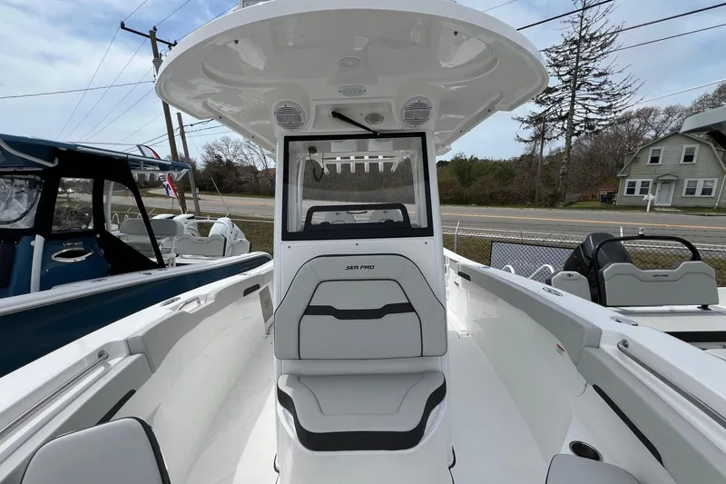 Slide: The Image of 2026 Sea Pro 262 Offshore boat interior with seating and helm station. - 8