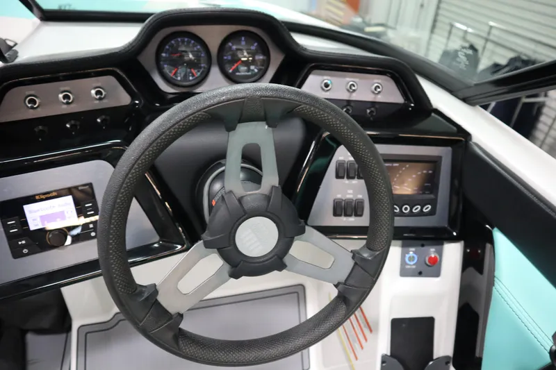 Slide: The Image of 2020 MasterCraft NXT22 dashboard with steering wheel, gauges, and control panel. - 11