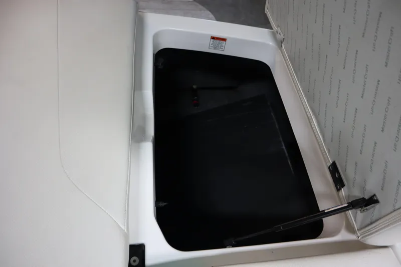 Slide: The Image of Open storage compartment in 2020 MasterCraft NXT22 boat, showcasing interior space. - 28