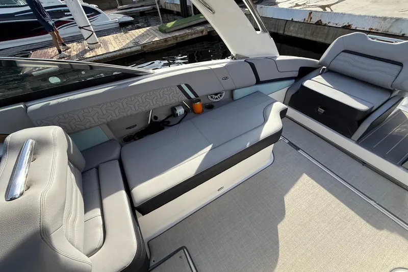 Slide: The Image of 2024 Regal LX9 boat interior with sleek gray seating and modern design. - 15