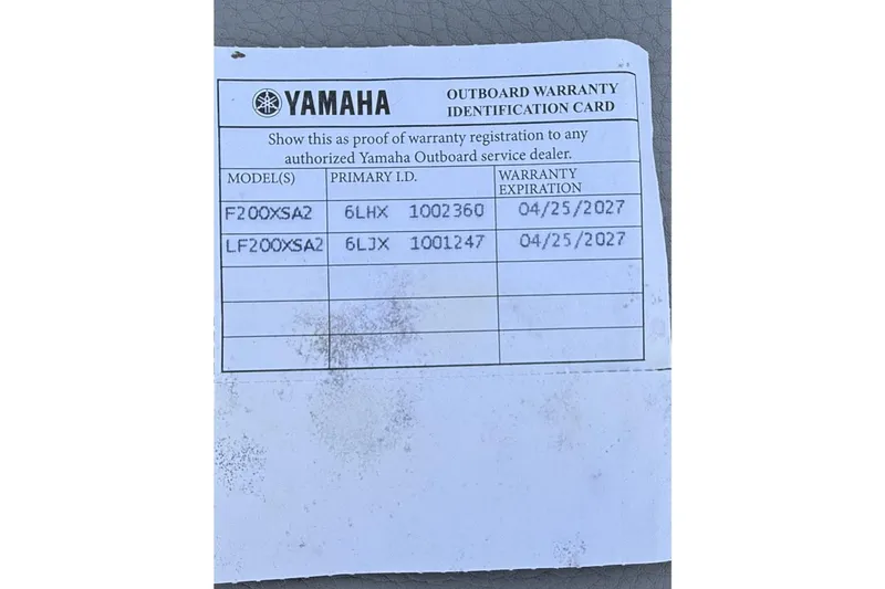 Slide: The Image of Yamaha outboard warranty card with model details and expiration dates. Regal LX9 2024. - 22