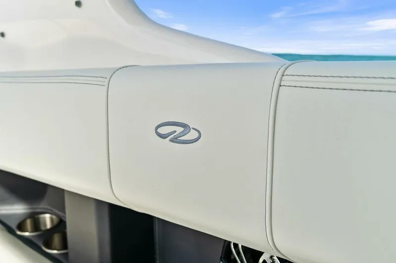 Slide: The Image of 2023 Regal 29 OBX boat interior with logo and cup holders. - 11