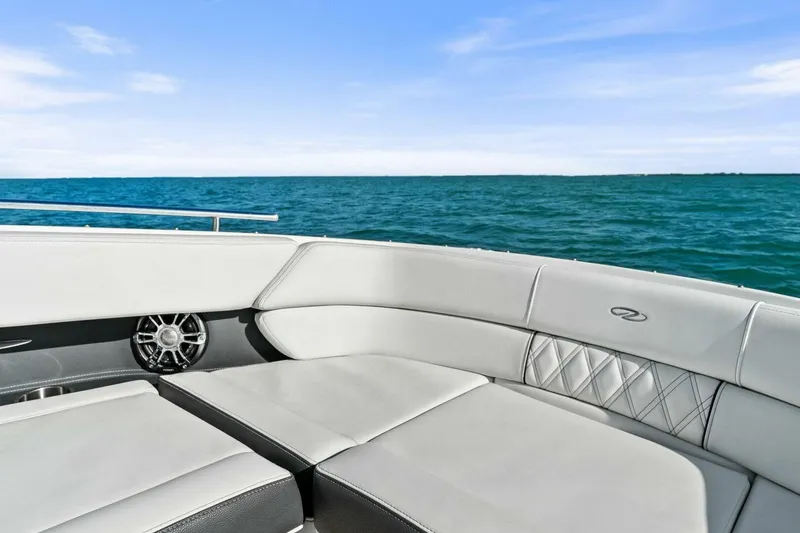 Slide: The Image of 2023 Regal 29 OBX boat interior with luxurious seating, ocean view. - 25