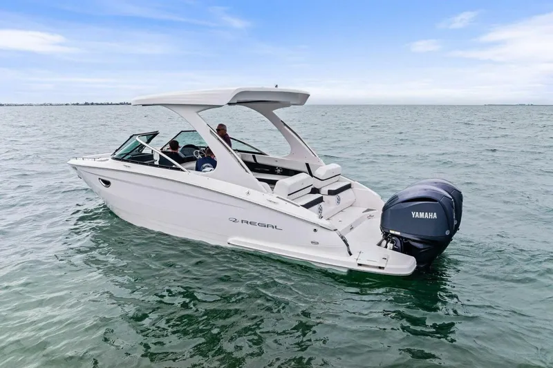 Slide: The Image of 2023 Regal 29 OBX boat with Yamaha engine on open water. - 33
