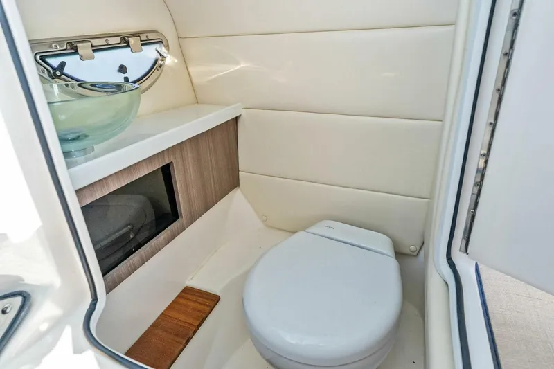 Slide: The Image of 2023 Regal 29 OBX boat bathroom with modern fixtures and compact design. - 5