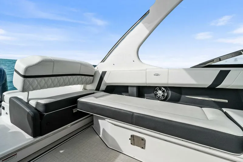 Slide: The Image of 2023 Regal 29 OBX boat interior with luxurious seating and modern design. - 9