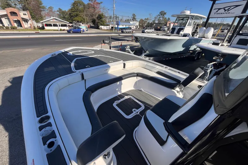 Slide: The Image of 2024 Tidewater 2500 Carolina Bay boat interior with steering wheel and control panel. - 10