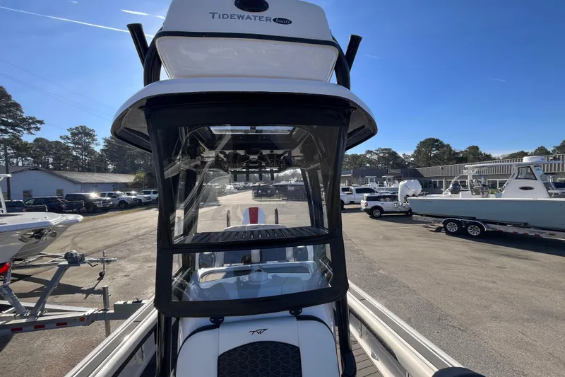 Slide: The Image of 2024 Tidewater 2500 Carolina Bay boat interior with seating and deck view. - 12