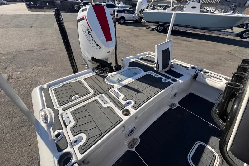 Slide: The Image of 2024 Tidewater 2500 Carolina Bay boat interior with steering console and seating. - 15