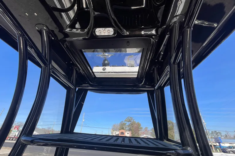Slide: The Image of 2024 Tidewater 2500 Carolina Bay T-top interior with clear sky view. - 20