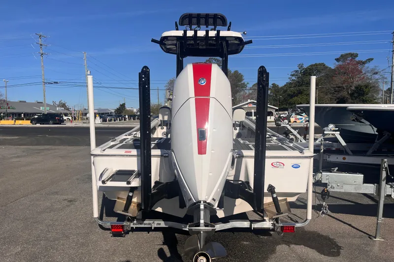 Slide: The Image of 2024 Tidewater 2500 Carolina Bay boat with powerful outboard motor, displayed outdoors. - 3