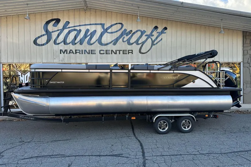 Slide: The Image of 2026 Godfrey Sweetwater 2486 SFL pontoon boat at StanCraft Marine Center. - 2