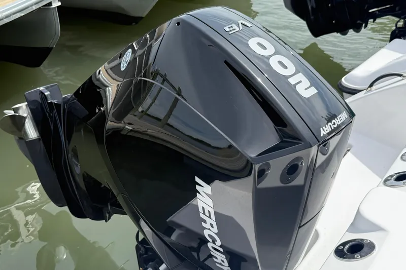 Slide: The Image of 2024 Aquasport 2200 Center Console with Mercury 400 V8 outboard engine. - 9