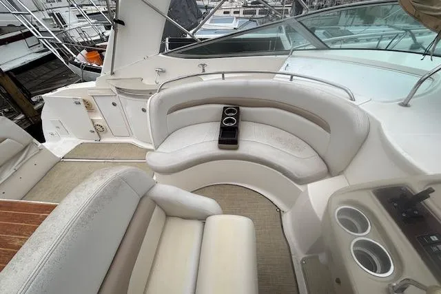 Slide: The Image of 2002 Chaparral Signature 350 boat interior with white seating and cup holders. - 12