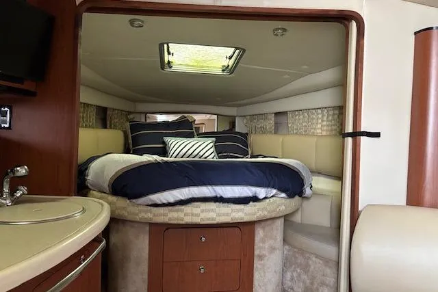 Slide: The Image of Interior of 2002 Chaparral Signature 350 yacht with cozy bed and modern amenities. - 14