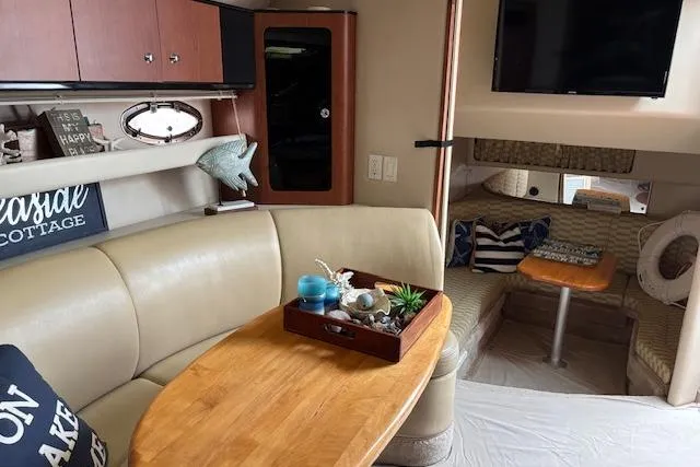 Slide: The Image of Interior of 2002 Chaparral Signature 350 yacht with cozy seating and decor. - 20