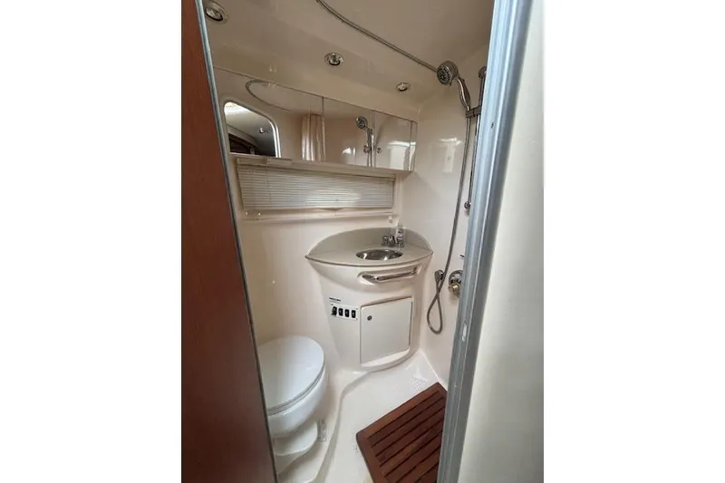 Slide: The Image of 2002 Chaparral Signature 350 yacht bathroom with sink, toilet, and shower. - 22