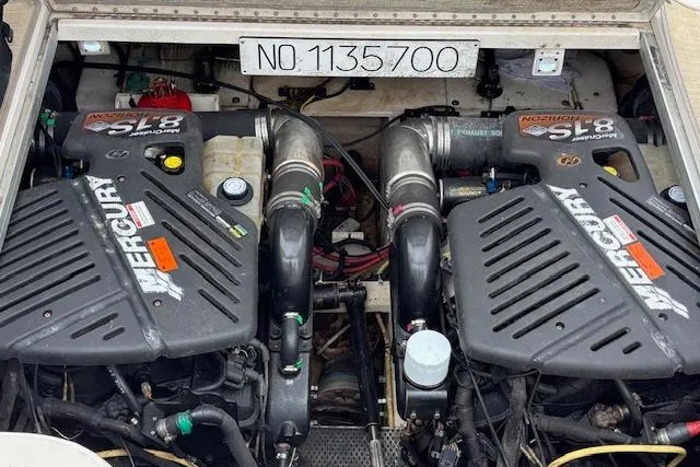 Slide: The Image of Twin Mercury engines in a 2002 Chaparral Signature 350 boat engine compartment. - 23