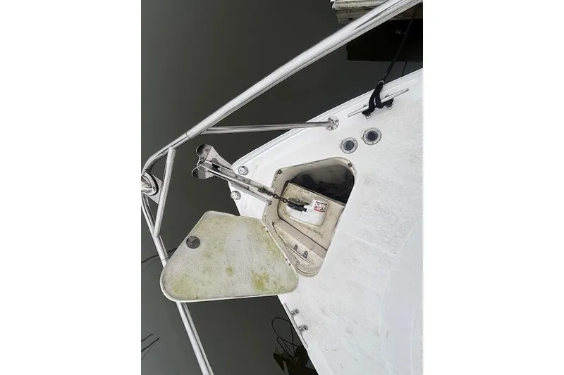 Slide: The Image of 2002 Chaparral Signature 350 boat anchor compartment with stainless steel railing. - 9
