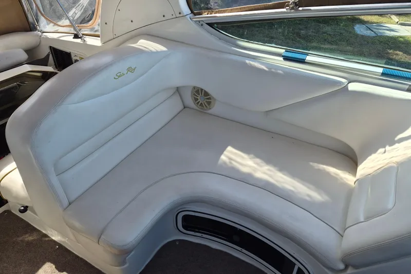 Slide: The Image of 2001 Sea Ray Sundancer 280 interior with white leather seating and window view. - 12