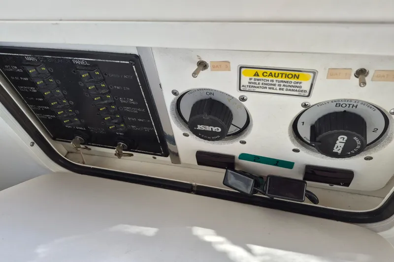 Slide: The Image of Control panel of a 2001 Sea Ray Sundancer 280 boat with caution label and switches. - 17
