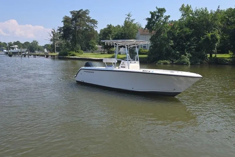 Slide: The Image of 2024 Aquasport 2200 Center Console boat on a calm river. - 3