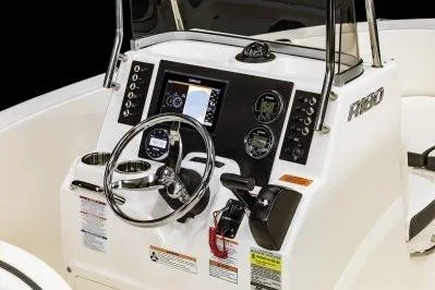 Slide: The Image of 2026 Robalo R180 Center Console dashboard with steering wheel and navigation controls. - 5