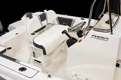 Slide: The Image of 2026 Robalo R180 Center Console boat interior with seating and steering console. - 7
