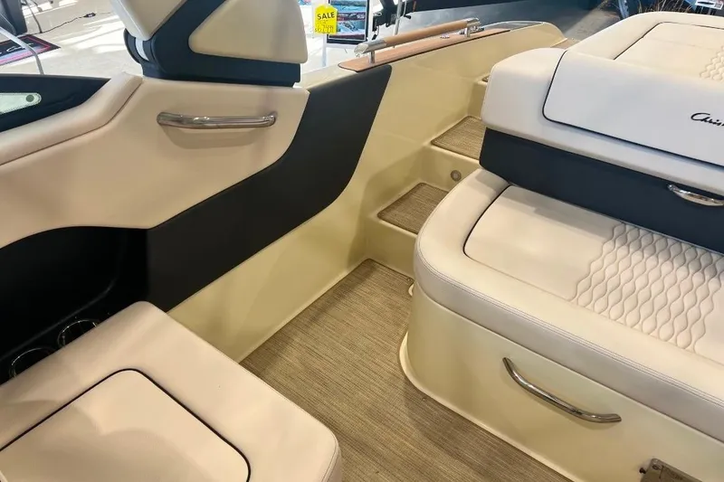 Slide: The Image of Interior of 2025 Chris-Craft Sportster 25 boat, featuring luxurious seating and modern design. - 11