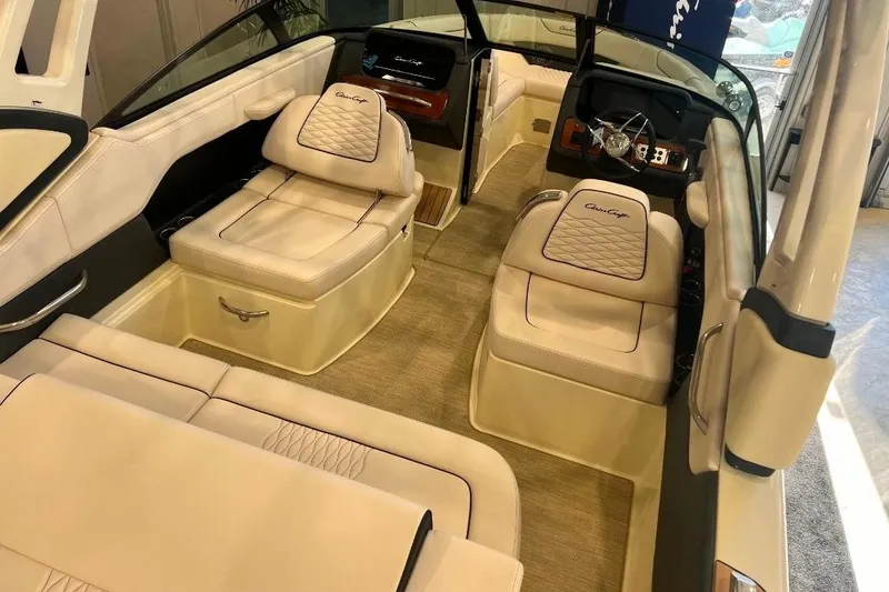 Slide: The Image of 2025 Chris-Craft Sportster 25 interior with luxurious seating and modern dashboard design. - 6