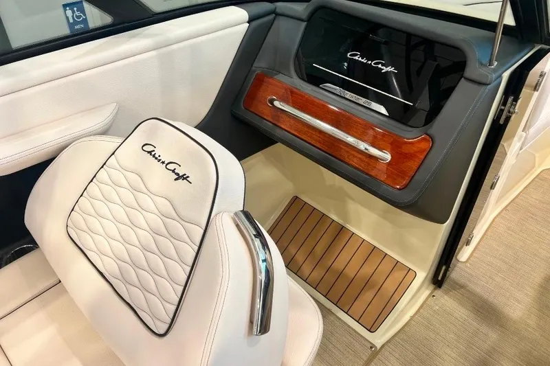 Slide: The Image of Interior of 2025 Chris-Craft Sportster 25, featuring elegant seating and wood accents. - 9