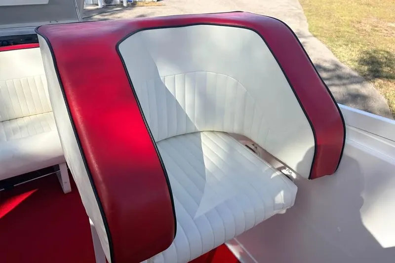 Slide: The Image of Red and white seating on 1983 Cigarette 24' Classic boat, showcasing vintage design. - 10