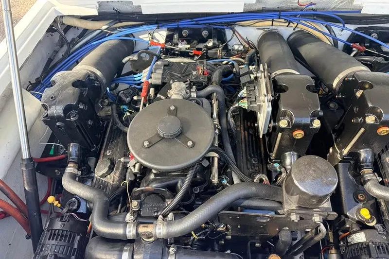 Slide: The Image of Engine of a 1983 Cigarette 24' Classic boat, showcasing intricate mechanical components. - 11