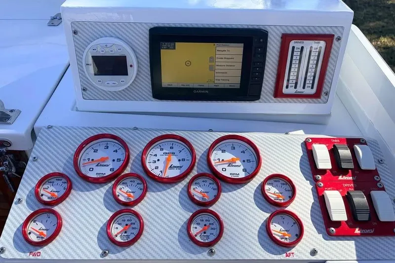 Slide: The Image of Dashboard of a 1983 Cigarette 24' Classic boat with gauges and controls. - 4