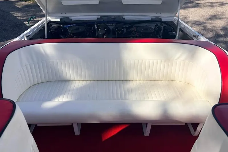 Slide: The Image of 1983 Cigarette 24' Classic boat interior with white and red seating. - 9