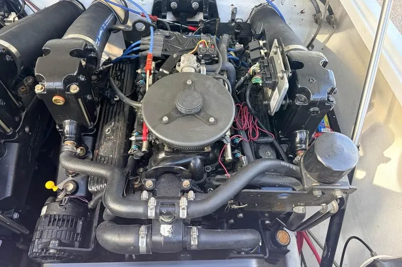Slide: The Image of 1983 Cigarette 24' Classic boat engine, detailed view of components and wiring. - 12