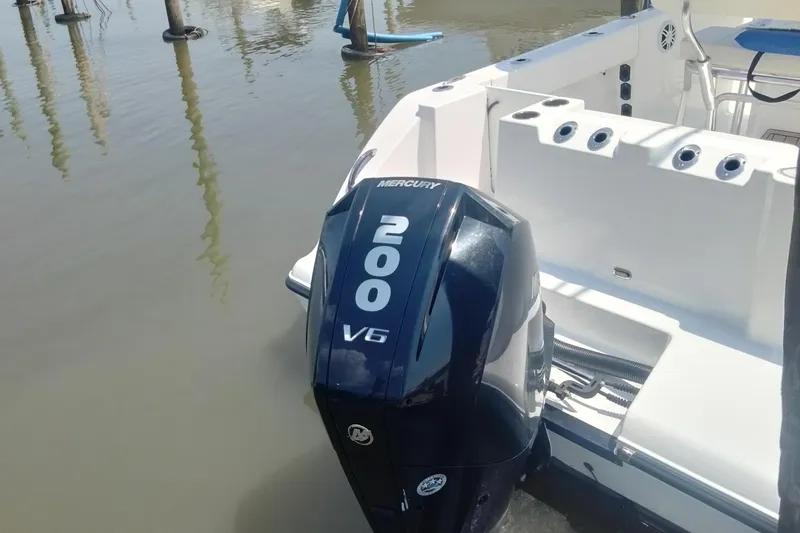 Slide: The Image of 2024 Aquasport 2200 Center Console with Mercury 200 V6 outboard engine. - 11