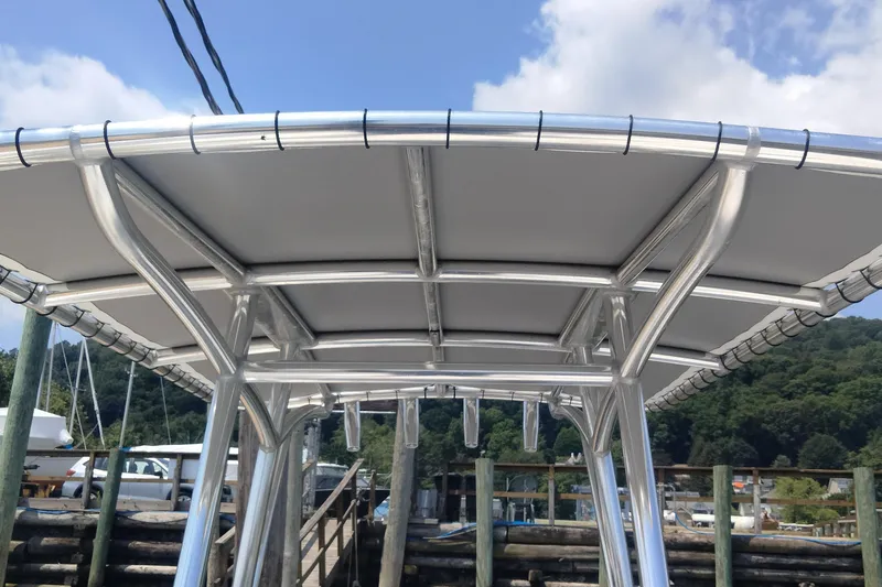 Slide: The Image of 2024 Aquasport 2200 Center Console T-top structure, showcasing sturdy aluminum framework. - 3