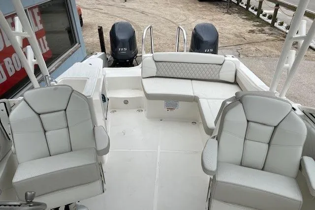 Slide: The Image of 2025 World Cat 230 SD boat interior with dual engines and plush seating. - 5