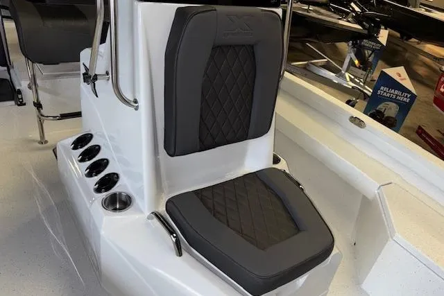 Slide: The Image of 2026 Xpress H20B Bay boat seat with diamond-stitched upholstery and cup holders. - 16