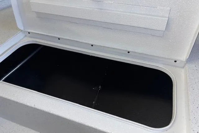 Slide: The Image of Open storage compartment in 2026 Xpress H20B Bay boat. - 20