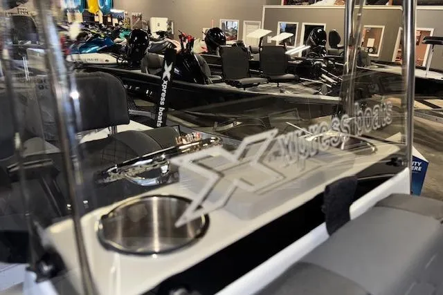 Slide: The Image of 2026 Xpress H20B Bay boat interior with logo, showroom display. - 27