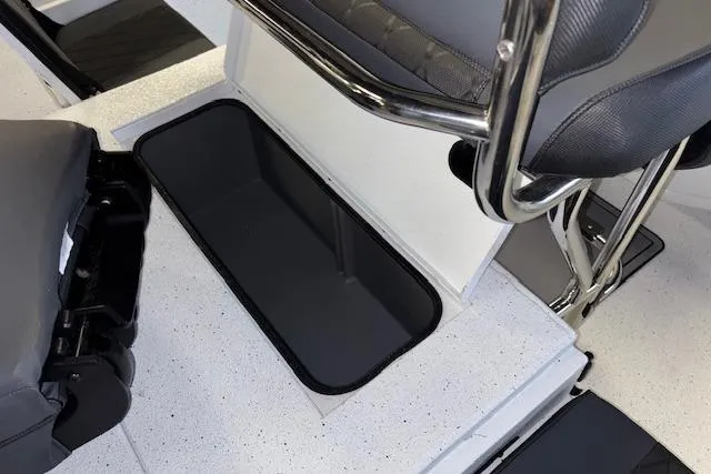 Slide: The Image of 2026 Xpress H20B Bay boat interior with storage compartment and seating. - 28