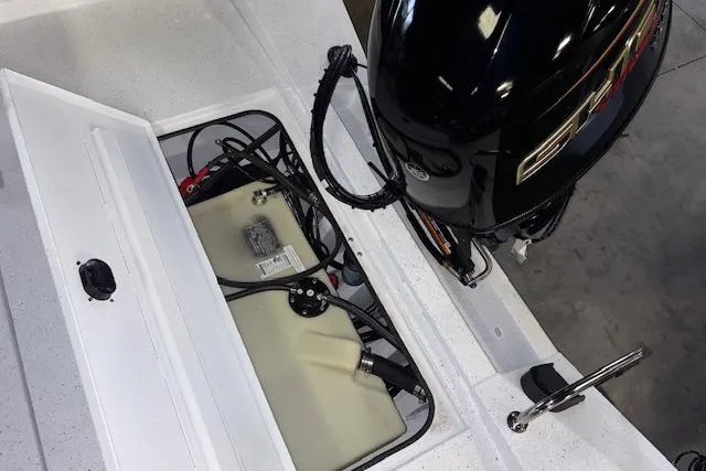 Slide: The Image of 2026 Xpress H20B Bay boat engine compartment with fuel tank and wiring. - 29