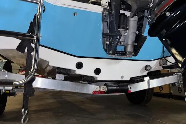 Slide: The Image of 2026 Xpress H20B Bay boat on trailer, showcasing hull and motor details. - 31